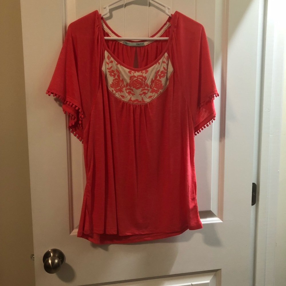 Maurice’s coral short sleeve shirt.
